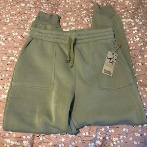 Sage green colored sweat pants